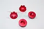 Four red anodized aluminium flanged serrated wheel nuts for RC cars arranged on a white background.