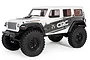 A white Axial SCX24 2019 Jeep Wrangler JLU CRC RC rock crawler on a white background.