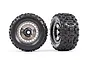 Two Traxxas 3.8 inch Sledgehammer RC monster truck tires mounted on black chrome modular wheels, shown from front and angled side views.