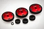 A set of Rovan metal RC gears including three large red-anodized spur gears labeled 50T, 52T, and 54T, three small black pinion gears, and a spacer.