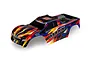 Traxxas 1/10 Maxx extended chassis pre-painted body shell in a multi-coloured graphic design featuring yellow, blue, red, and black.