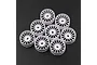 A set of eight white multi-spoke RC car rims arranged on a dark textured surface.
