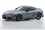 A grey metallic Kyosho Mini-Z Toyota Supra GR pre-painted body shell shown from a front three-quarter angle against a white background.