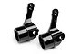 A pair of black anodized aluminium steering hubs for HPI Trophy RC vehicles, shown against a white background.