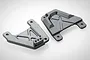 Two black anodized aluminium RC shock tower plates with mounting holes, shown from an angled perspective on a white background.