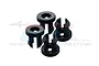 Four black plastic shock cap spacers for RC cars arranged on a white background.