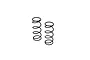 Two black metal RC shock absorber springs standing upright against a white background.