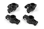 A set of four black plastic RC steering and rear hub components arranged on a white background.