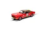 A 1/32 scale Scalextric Ford Mustang slot car in red and gold livery with number 6, shown on a track section.
