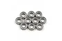 A set of ten small metal shielded ball bearings arranged in a cluster on a white background.