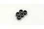 A cluster of five small black metal grub screws with hexagonal sockets, viewed from above against a white background.