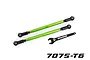 Two green anodized aluminium Traxxas front toe links with black rod ends and an included black adjustment wrench on a white background.