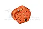 An orange anodized aluminium gearbox case for RC cars by GPM Racing, featuring a 7075 alloy marking.