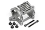 A silver cast metal RC motor mount with cooling fins and four short black screws and two long black socket head screws on a white background.