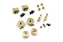 A set of gold-colored brass RC upgrade parts including hubs, wheel hexes, and diff covers on a white background.