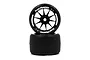 Two Team Powers 1/10 scale F1 rubber rear tyres on black multi-spoke wheels stacked vertically against a white background.