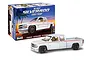 A Revell 1/25 scale 1999 Chevy Silverado Street Pickup plastic model kit box and a fully assembled white model truck.