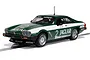 A 1/32 scale Scalextric Jaguar XJS slot car in green and white livery with number 2, displayed on a section of slot car track.