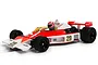 A 1/32 scale Scalextric McLaren M23 slot car in red and white livery with number 29, featuring a driver figure and Goodyear branding.