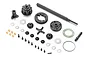 A complete XRAY gear differential set including various plastic gears, metal shafts, screws, shims, and an O-ring laid out on a white background.