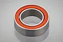 A single metal ball bearing with an orange rubber seal, shown in a studio product shot against a light grey background.