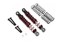 Two black and red RC shock absorbers with extra springs, screws, and spacers on a white background.