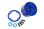 A blue anodized aluminium differential case for Traxxas RC vehicles, including a gasket, four screws, and two small washers on a white background.