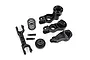 Traxxas steering bellcrank and drag link assembly parts including plastic arms, a metal spring, and small screws on a white background.