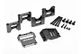 A set of Traxxas aluminium centre differential mount parts including metal brackets, a cover, and various screws on a white background.