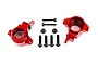 A pair of red anodized aluminium steering hubs for Traxxas RC vehicles, accompanied by mounting screws and lock nuts on a white background.