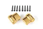 Two brass-coloured Traxxas axle covers with TRX branding and eight black mounting screws on a white background.