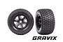 Two Traxxas Gravix RC monster truck wheels with black rims and aggressive tread patterns, shown from front and side angles against a white background.