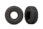 Two black Traxxas Canyon Trail RC crawler tires shown from side and angled views against a white background.