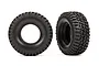 Two black Traxxas 1.0 inch BFGoodrich Mud-Terrain T/A KM3 RC crawler tyres shown from front and side angles against a white background.