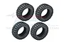 Four black rubber RC crawler tyres with aggressive tread patterns arranged in a square formation against a white background.