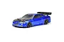 A studio shot of a blue Protoform 1/7 scale Nissan Skyline GT-R R34 RC car body shell with a carbon fiber look hood and rear wing.