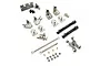 A collection of gunmetal aluminium RC car upgrade parts including steering knuckles, drive shafts, and linkage rods on a white background.