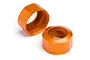 Two orange anodized aluminium shock caps for RC cars, shown from an angle on a white background.