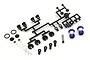 Kyosho unassembled aluminium shock absorber set including two blue anodized shock bodies, plastic parts on a sprue, metal shafts, and small hardware.