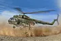 Box art illustration of a Mil Mi-8 Hip helicopter hovering over soldiers in a dusty desert environment.