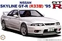 Box art illustration of a white 1995 Nissan Skyline R33 GT-R model car, featuring the Fujimi logo and model name text.