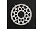 A white Delrin spur gear with 76 teeth and 64dp pitch, featuring a lightweight design with circular cutouts, set against a black textured background.