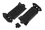 Two black plastic Traxxas skid plates and one small separate black plastic component on a white background.