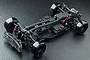Top-down view of an assembled MST RMX 2.5 Classic 1/10 scale RC drift car chassis on a textured black background.