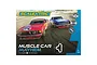 Scalextric Muscle Car Mayhem slot car set box featuring a red Ford Mustang and blue Chevrolet Camaro racing on a track.