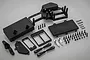 A Rovan dual steering servo tray kit including black plastic mounts, covers, two silver aluminium servo horns, and various screws and clips.