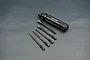 Koswork quick release hex driver handle with five interchangeable hex driver bits of varying sizes on a grey background.