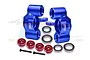 A set of blue anodized aluminium steering hubs for RC cars, including red washers, screws, and ball bearings on a white background.