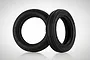 Two black Tamiya RC buggy front tyres with Super Gripper Racing branding on a white background.