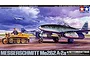 Box art for Tamiya 1/48 scale Messerschmitt Me262 A-2a model kit showing the aircraft being towed by a Kettenkraftrad on an airfield.